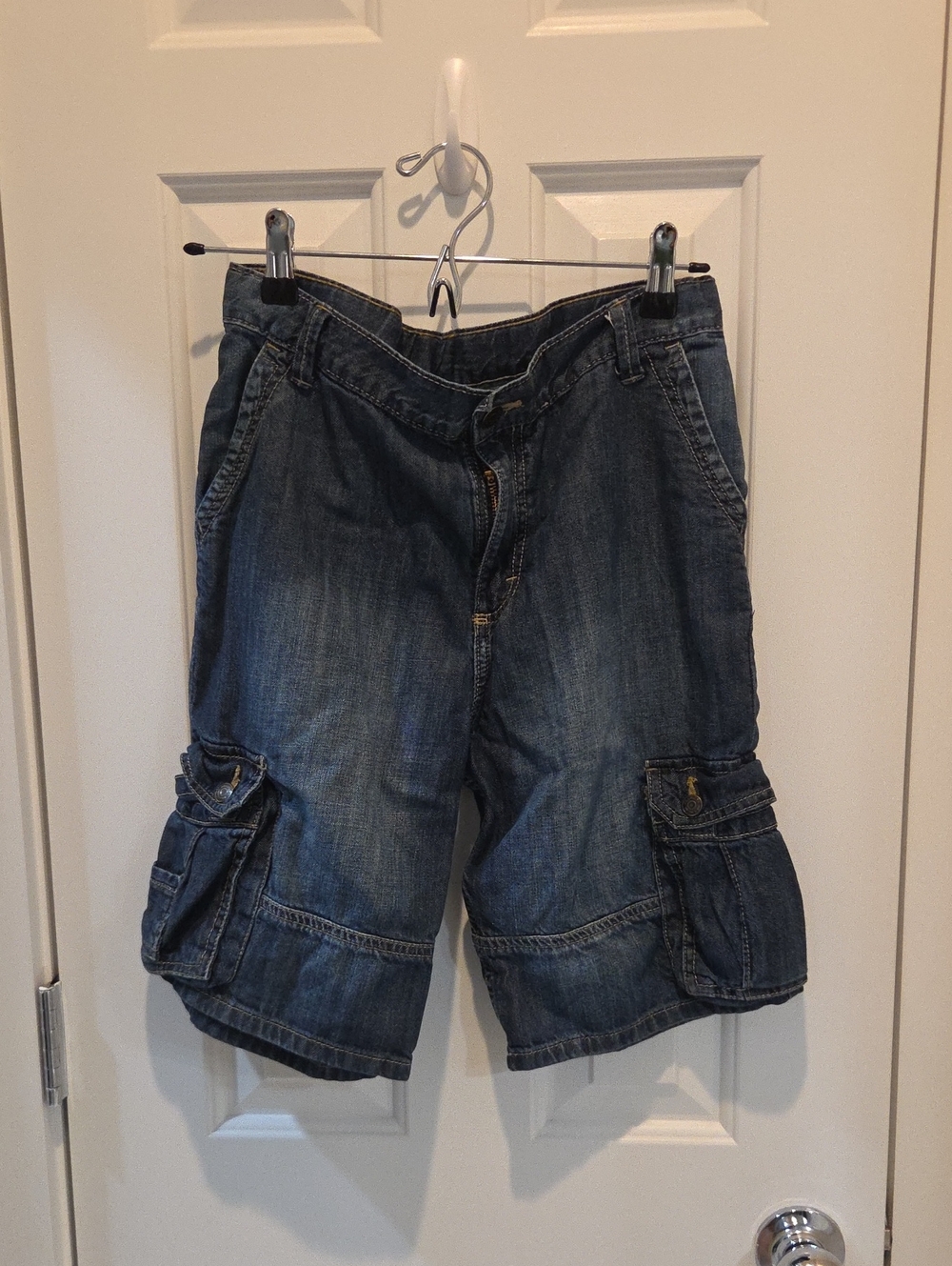 boys' denim cargo shorts with utility flap pockets on the sides.